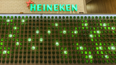 A Heineken bar illuminated by green lights.