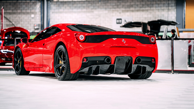 The rear end of a beautiful Red Ferrari.