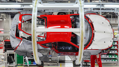 A Ferrari car in production on the assembly line.