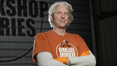 Edd China posing with arms crossed